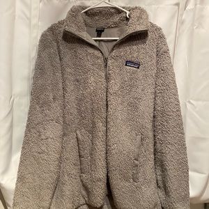 Grey Patagonia zip up jacket.